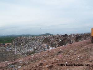a wall of trash within Gramacho landfill