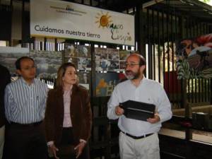 Minister Lozano with pesticide container during Earth Day event